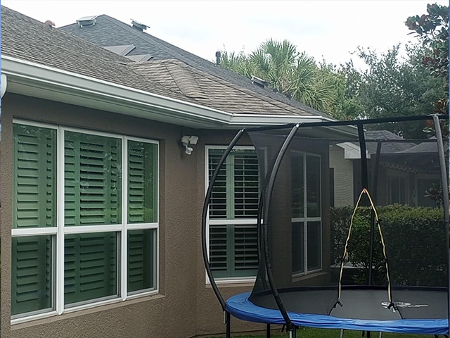 a trampoline in a backyard of a house